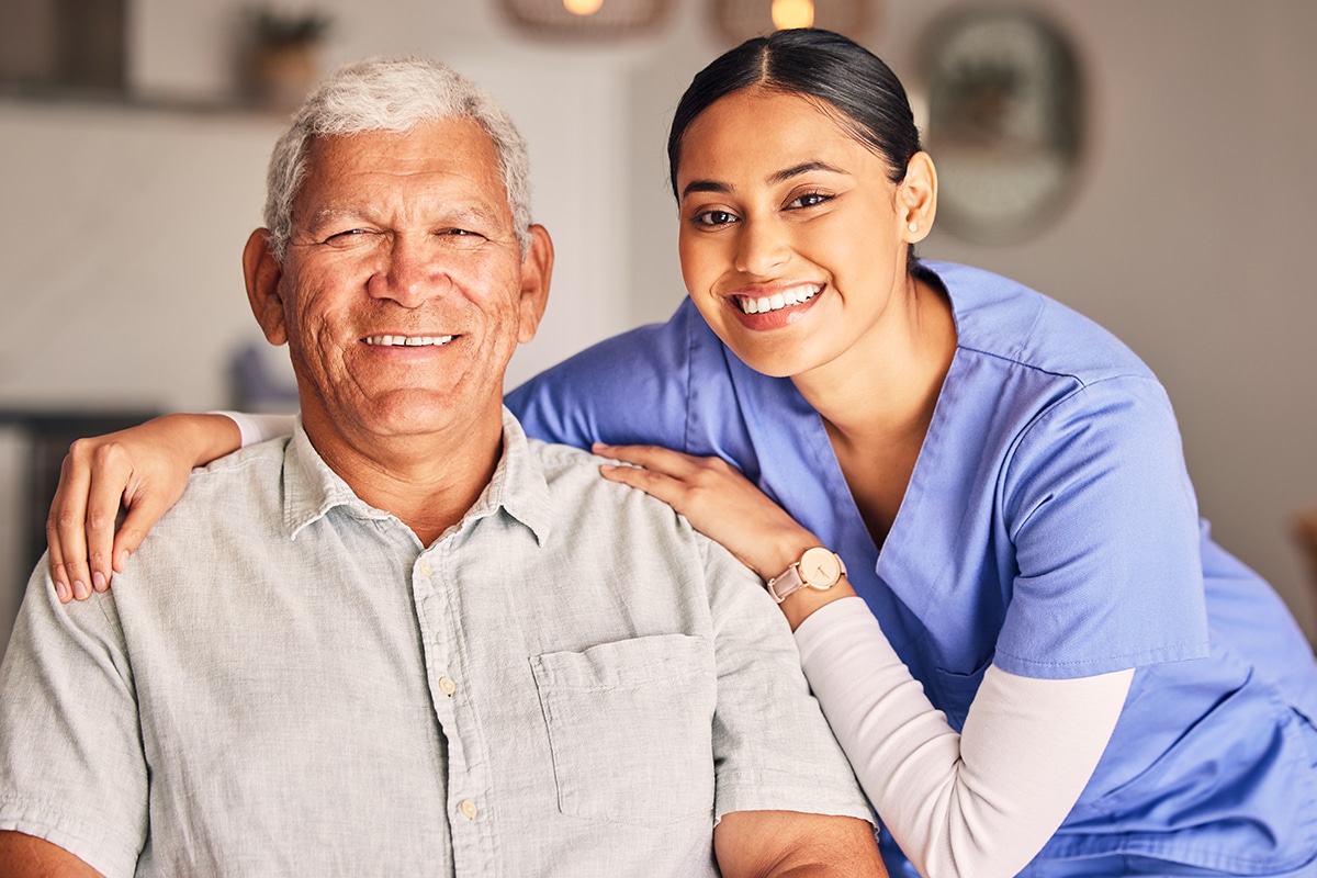 Happy woman, nurse and portrait of senior man with support, medical service and helping patient in retirement. Face of caregiver, elderly person and smile for trust, healthcare and nursing home